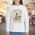 On My Way To Hoard Books And Cause Chaos Tom Foolery Youth Long Sleeve Tee On My Way To Hoard Books And Cause Chaos Tom Foolery Youth Long Sleeve Tee