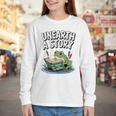 Unearth a Story Frog Reading a Book Summer 2026 Premium Tri-Blend Youth Long Sleeve Tee