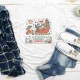 Book Lovers Winter Sleighing Through Stories Tee Premium Tri-Blend Youth Long Sleeve Tee