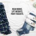 Read Books Lift Weights Fight Fascists Premium Tri-Blend Youth Long Sleeve Tee Read Books Lift Weights Fight Fascists Premium Tri-Blend Youth Long Sleeve Tee