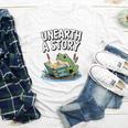 Unearth a Story Frog Reading a Book Summer 2026 Premium Tri-Blend Youth Long Sleeve Tee