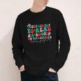 Groovy Christmas Most Likely To Read A Book On Christmas Youth Long Sleeve Tee