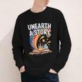 Unearth A Story Rainbow Treasure Book Youth Long Sleeve Tee Unearth A Story Rainbow Treasure Book Youth Long Sleeve Tee