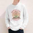 Unearth a Story 2026 Summer Reading Program Flowers Book Premium Tri-Blend Youth Long Sleeve Tee Unearth a Story 2026 Summer Reading Program Flowers Book Premium Tri-Blend Youth Long Sleeve Tee