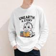 Unearth a Story Cute Dinosaur Summer Reading 2026 Dino Book Youth Long Sleeve Tee