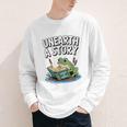 Unearth a Story Frog Reading a Book Summer 2026 Premium Tri-Blend Youth Long Sleeve Tee