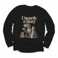 Unearth A Story Dinosaur Reading a Library Book Youth Long Sleeve Tee