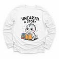 Unearth a Story Cute Dinosaur Summer Reading 2026 Dino Book Youth Long Sleeve Tee