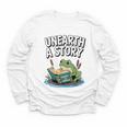 Unearth a Story Frog Reading a Book Summer 2026 Premium Tri-Blend Youth Long Sleeve Tee