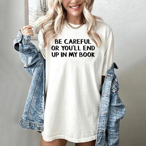 Be Careful Or You’Ll End Up In My Book Women's Comfort Colors T-Shirt - Bookorys CA