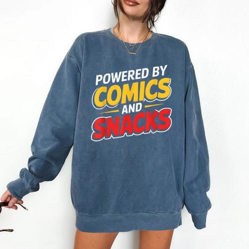 Powered By Comics And Snacks Comic Book Lover Comfort Colors Sweatshirt - Bookorys