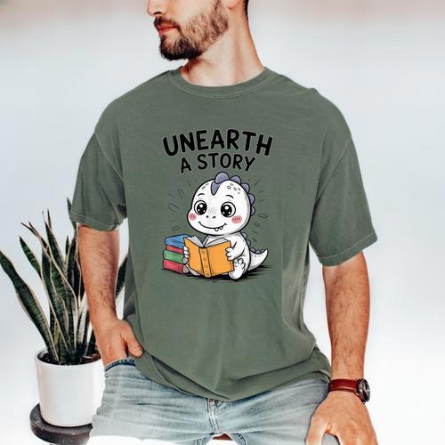 Unearth a Story Cute Dinosaur Summer Reading 2026 Dino Book Men's Comfort Colors T-Shirt - Bookorys