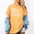 The Book Of Mormon Musical Characters Women's Comfort Colors T-Shirt Mustard The Book Of Mormon Musical Characters Women's Comfort Colors T-Shirt Mustard