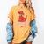 Clifford The Big Red Dog Pink Text With Bow Illustrated Book Women's Comfort Colors T-Shirt Mustard Clifford The Big Red Dog Pink Text With Bow Illustrated Book Women's Comfort Colors T-Shirt Mustard