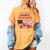 Cupid's Favorite Math Teacher Valentine Reading Book Women Women's Comfort Colors T-Shirt Mustard Cupid's Favorite Math Teacher Valentine Reading Book Women Women's Comfort Colors T-Shirt Mustard