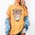 Dungeon Crawler Carl Airbrushed Princess Donut Series Book Women's Comfort Colors T-Shirt Mustard Dungeon Crawler Carl Airbrushed Princess Donut Series Book Women's Comfort Colors T-Shirt Mustard
