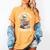 One More Chapter Skeleton Reading Books Lovers Readers Women's Comfort Colors T-Shirt Mustard