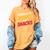 Powered By Comics And Snacks Comic Book Lover Women's Comfort Colors T-Shirt Mustard Powered By Comics And Snacks Comic Book Lover Women's Comfort Colors T-Shirt Mustard