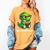 Readasaurus Reading Dinosaur Book Reader Bookworm Women's Comfort Colors T-Shirt Mustard