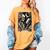 The Reader Tarot Card Skeleton Reading Book Bookworm Bookish Women's Comfort Colors T-Shirt Mustard The Reader Tarot Card Skeleton Reading Book Bookworm Bookish Women's Comfort Colors T-Shirt Mustard