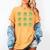 Teacher Reading Shamrock St Patrick’s Day Book Lover Kids Women's Comfort Colors T-Shirt Mustard