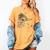 Tucson Festival Of Books TFOB 2017 Roadrunner Mascot Women's Comfort Colors T-Shirt Mustard Tucson Festival Of Books TFOB 2017 Roadrunner Mascot Women's Comfort Colors T-Shirt Mustard
