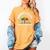 Women's Unearth a Story 2026 Summer Reading Program Tree Book Women's Comfort Colors T-Shirt Mustard Women's Unearth a Story 2026 Summer Reading Program Tree Book Women's Comfort Colors T-Shirt Mustard