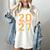 Class Of 2027 Graduation Varsity Orange On The Back Premium Tri-Blend Women's Comfort Colors T-Shirt Ivory