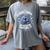 A Good Book Is Out Of This World Shirt Astronaut Reading Women's Comfort Colors T-Shirt Gray