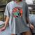 Grim Reaper Reads a Book Women's Comfort Colors T-Shirt Gray Grim Reaper Reads a Book Women's Comfort Colors T-Shirt Gray