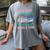 THIS LADY Will Never Own Enough BOOKS & YARN Women's Comfort Colors T-Shirt Gray