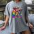 Rainbow Pride Bigfoot Reading Book With Heart Glasses Women's Comfort Colors T-Shirt Gray