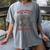 Read Books Be Kind Stay Weird Bookish Cowboy Reading Raccoon Women's Comfort Colors T-Shirt Gray