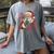 He Sees What You'Ve Been Reading Bookish Christmas Humor Women's Comfort Colors T-Shirt Gray He Sees What You'Ve Been Reading Bookish Christmas Humor Women's Comfort Colors T-Shirt Gray