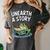 Unearth a Story Frog Reading a Book Summer 2026 Premium Tri-Blend Women's Comfort Colors T-Shirt Pepper Unearth a Story Frog Reading a Book Summer 2026 Premium Tri-Blend Women's Comfort Colors T-Shirt Pepper