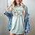 Groovy Christmas Most Likely To Read A Book On Christmas Women's Comfort Colors T-Shirt Denim