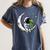 Astronaut Reading Book To Alien Moon Space Astronomy Women's Comfort Colors T-Shirt Moss Astronaut Reading Book To Alien Moon Space Astronomy Women's Comfort Colors T-Shirt Moss