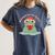 Bookmarks Are For Quitters Frog Reading Book Graphic Women's Comfort Colors T-Shirt Moss