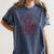 Books A Well-Read Woman Is A Dangerous Creature Women Premium Tri-Blend Women's Comfort Colors T-Shirt Moss