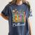 Booktrovert Book Reader Book Nerd Book Reading Lover Premium Tri-Blend Women's Comfort Colors T-Shirt Moss