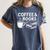 Coffee & Books Women's Comfort Colors T-Shirt Moss