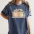Cute Cat Sleeping On Books Women's Comfort Colors T-Shirt Moss