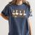 Fall Goose Reading Book Teacher Autumn Pumpkin Cozy Season Women's Comfort Colors T-Shirt Moss