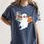 Ghost Reading Books Halloween Library Women's Comfort Colors T-Shirt Moss Ghost Reading Books Halloween Library Women's Comfort Colors T-Shirt Moss