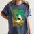 Groovy Ghost Reading Book Cat Halloween Ghost Teacher Women's Comfort Colors T-Shirt Moss