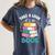 Take a Look It's In a Book Teacher Reading Apparel Women's Comfort Colors T-Shirt Moss