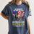 In Memory Of The 58479 Brothers & Sisters On Back Women's Comfort Colors T-Shirt Moss In Memory Of The 58479 Brothers & Sisters On Back Women's Comfort Colors T-Shirt Moss