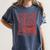 North Pole Book Club Christmas Women's Comfort Colors T-Shirt Moss North Pole Book Club Christmas Women's Comfort Colors T-Shirt Moss