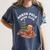 North Pole Book Club Gingerbread Christmas Reading Women's Comfort Colors T-Shirt Moss