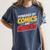 Powered By Comics And Snacks Comic Book Lover Women's Comfort Colors T-Shirt Moss Powered By Comics And Snacks Comic Book Lover Women's Comfort Colors T-Shirt Moss